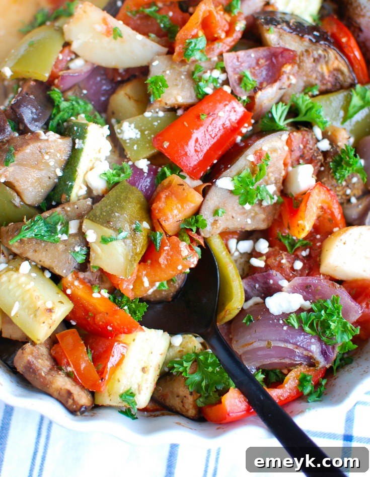 Greek Roasted Vegetables {Briami} are tender, flavorful vegetables that are roasted in a tomato based sauce and topped with fresh parsley and feta cheese. These vegetables work great over rice, paired with pasta or as a side dish to your meal.