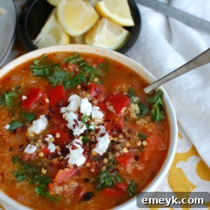 Tomato Red Pepper Bulgur Soup garnished with fresh parsley, ready to serve.