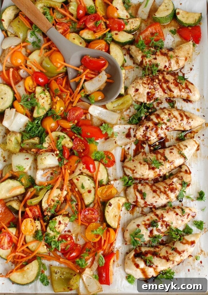Sheet Pan Honey Balsamic Chicken Tenders and Vegetables on a baking pan before cooking.