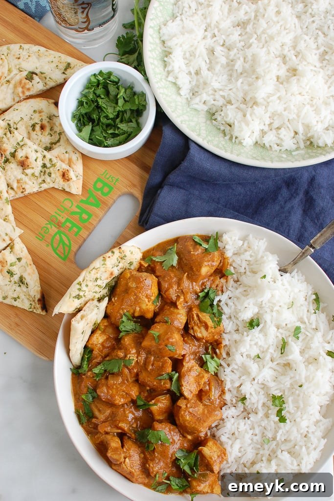 Slow Cooker Butter Chicken served over basmati rice.