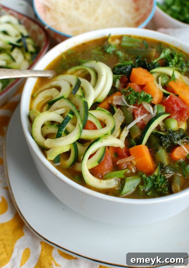 Garden Fresh Spring Minestrone 6 Spring Vegetable Minestrone in a bowl with a spoon, highlighting the texture of the vegetables and the rich broth.