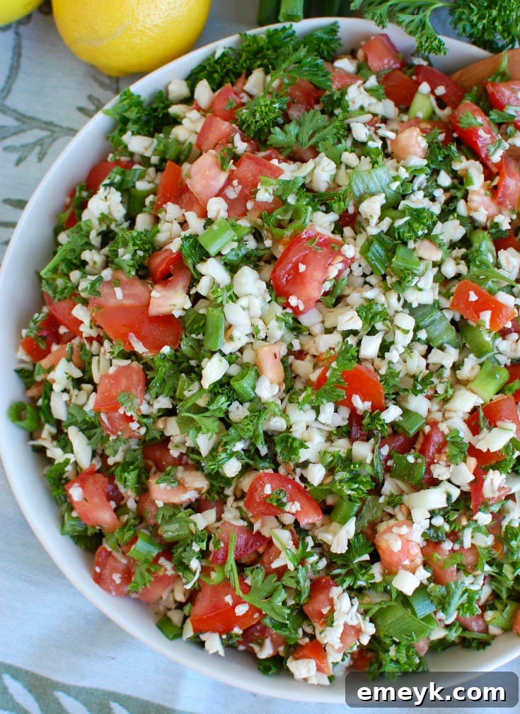 Grain-Free Cauliflower Tabbouleh 5 A large bowl of Cauliflower Tabbouleh, showcasing the vibrant colors and fresh ingredients.