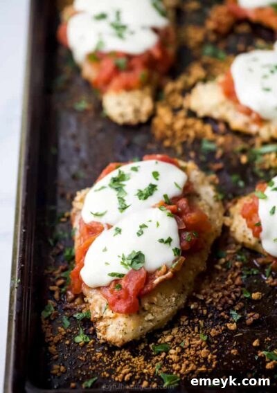 Light Baked Chicken Parmesan with Zucchini Noodles, a healthier classic.