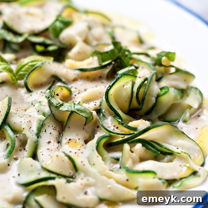 Zucchini Fettuccine with Creamy White Bean Alfredo Sauce, a healthy and dairy-free pasta alternative.