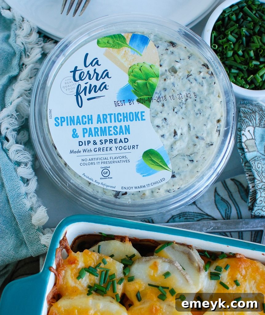 Close-up of La Terra Fina's Spinach Artichoke & Parmesan Greek Yogurt Dip, the secret ingredient for the scalloped potatoes.