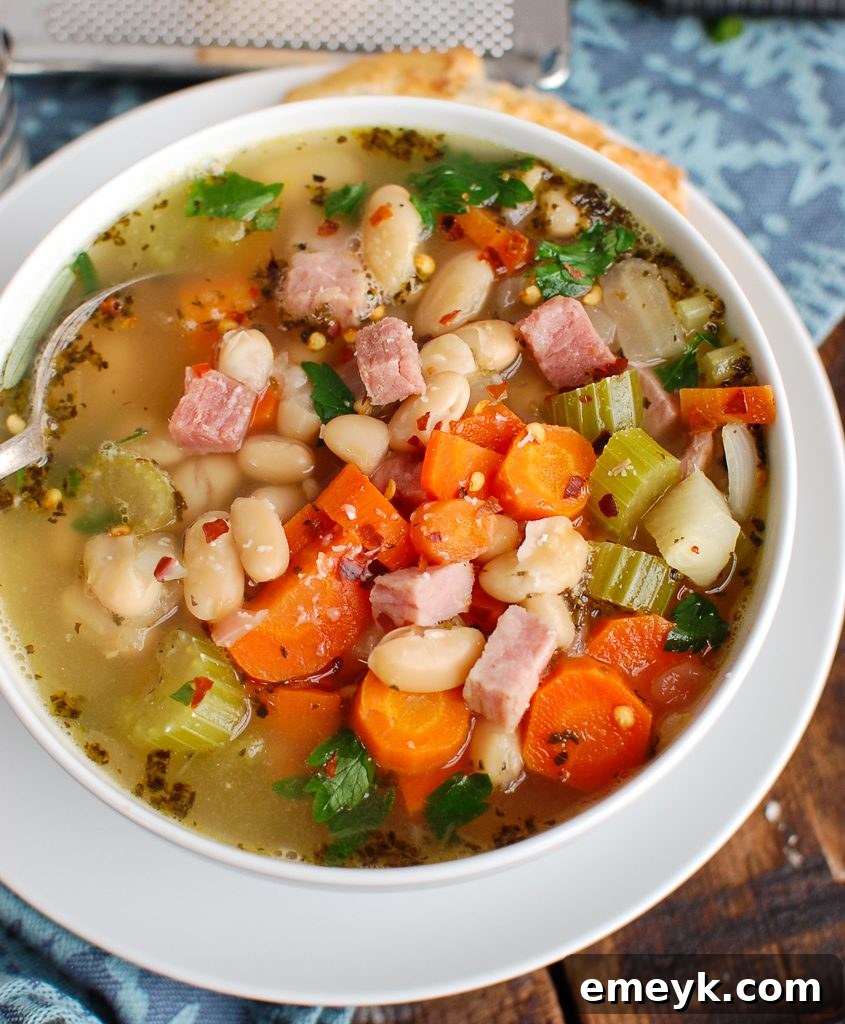 Hearty White Bean and Ham Soup with a spoon