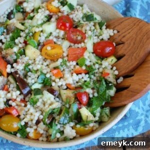 Mediterranean Grilled Vegetable Couscous Salad in a large white bowl, top-down view.
