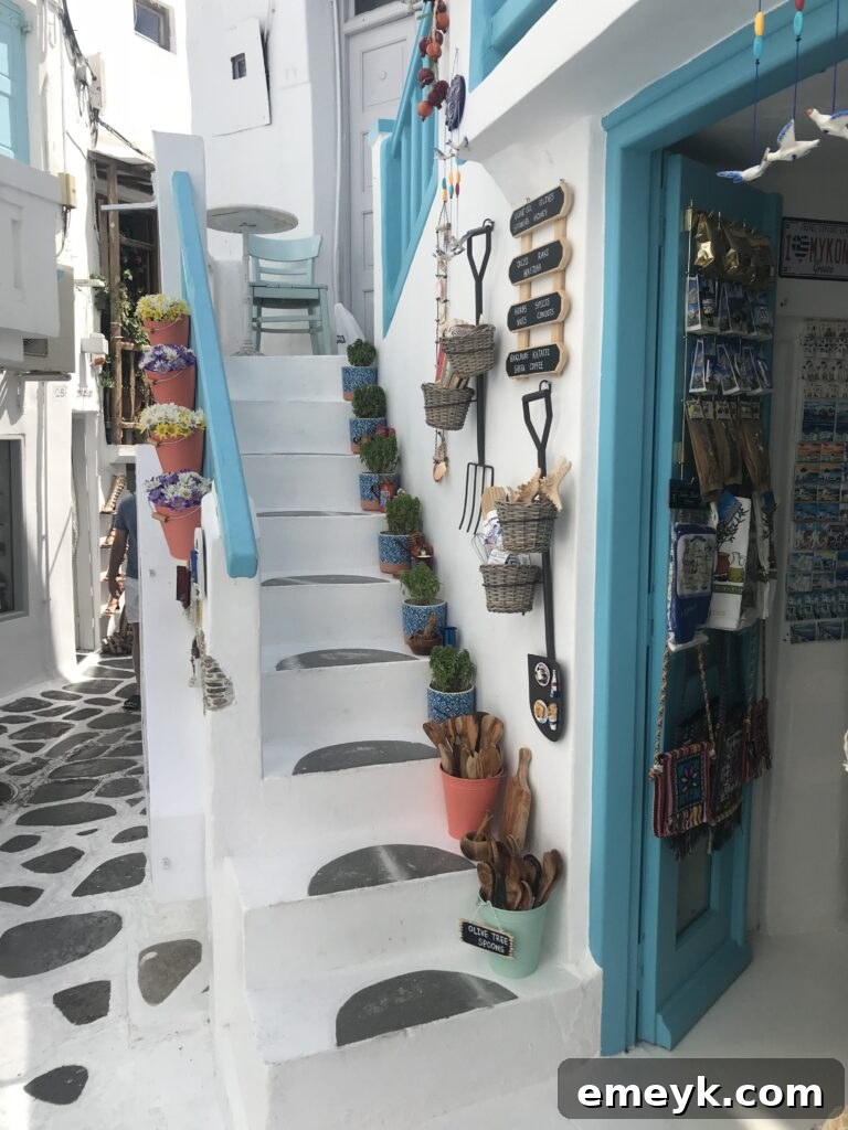 Charming narrow streets of Mykonos, Greece, showcasing traditional architecture.
