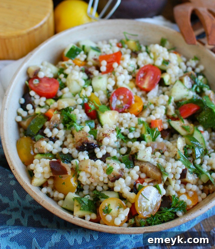 A bowl of Mediterranean Grilled Vegetable Couscous Salad, ideal as a healthy side dish.