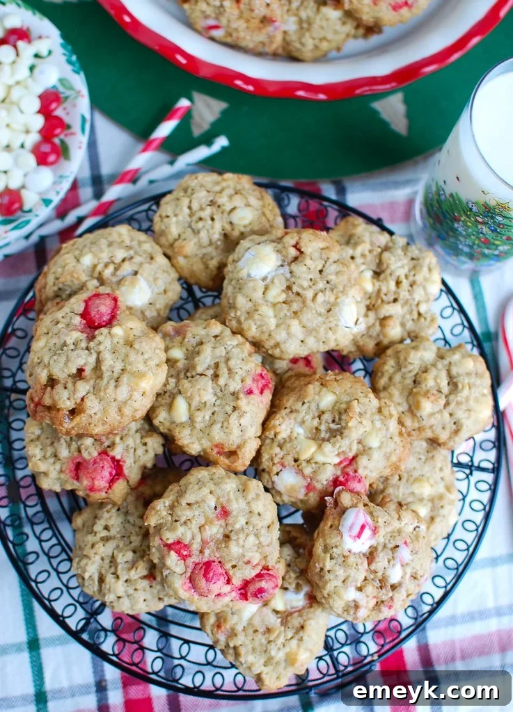 Wintermint White Chocolate Oat Cookies 3 Close-up of freshly baked Oatmeal White Chocolate Peppermint Cookies, showing the vibrant M&Ms and crushed candy cane