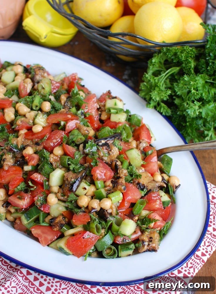 Side view of Mediterranean Eggplant Chickpea Salad, showcasing its fresh ingredients and vibrant colors