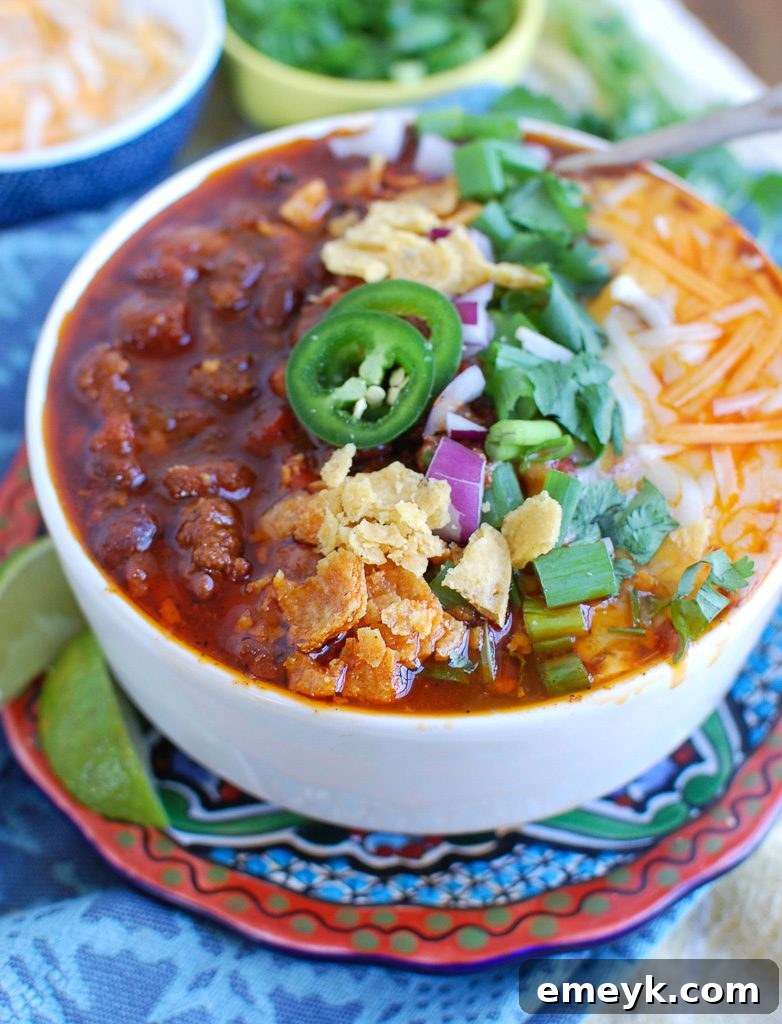 Easy Instant Pot Beef Chili Side View - A delicious, hearty bowl of chili with a spoon