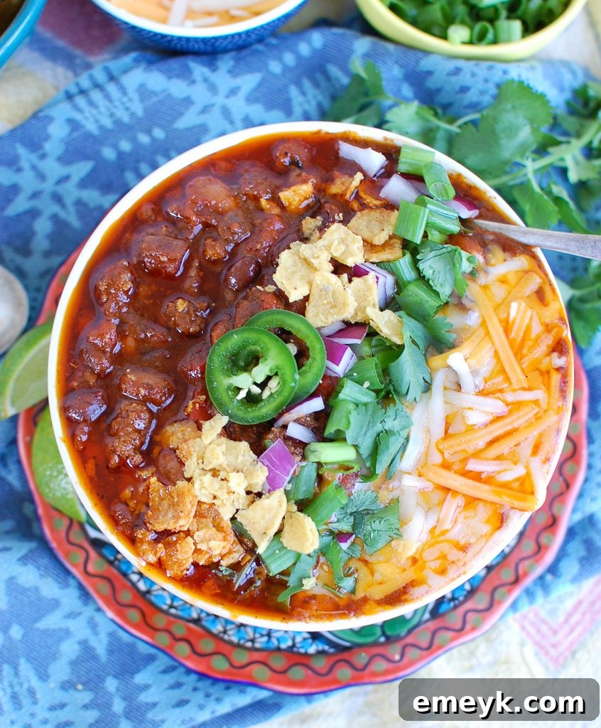 Easy Instant Pot Beef Chili Above - Garnished with fresh cilantro and cheese