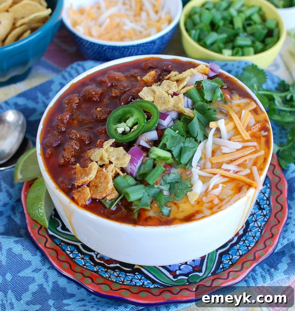 Easy Instant Pot Beef Chili in a White Bowl - Garnished and ready to eat