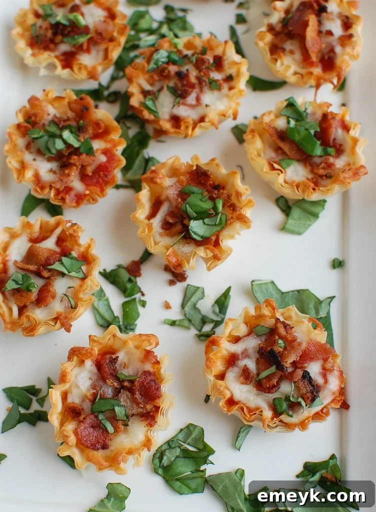 Crispy Bacon Pizza Bites on a elegant white platter, garnished lightly