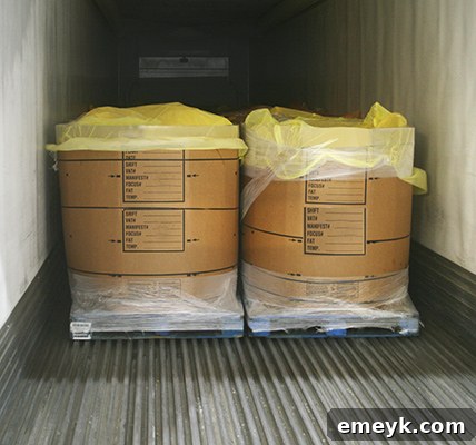 Raw pork bellies in large containers, ready for processing