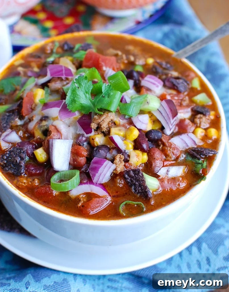 A bowl of delicious Instant Pot Turkey Chili, garnished and ready to eat.
