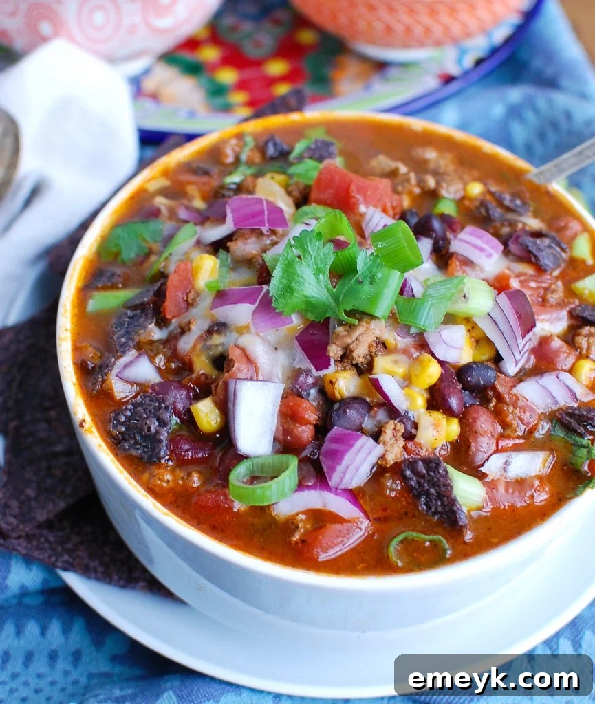 A pristine white bowl filled with Instant Pot Turkey Chili, suggesting freshness and health.