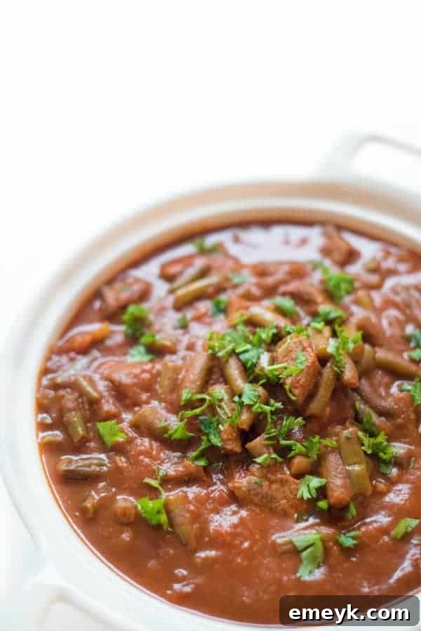 Traditional Slow Cooker Lebanese Green Beans and Beef, simmered in a savory tomato-based sauce with authentic spices.