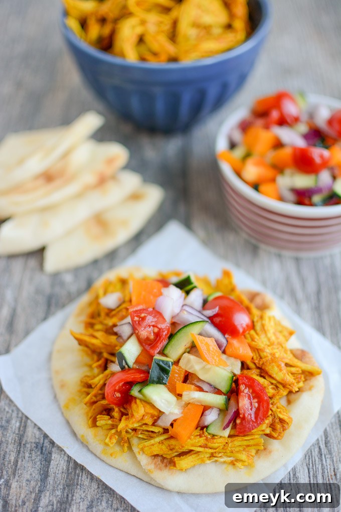 Tender Persian Pulled Chicken, ideal for slow cooker or Instant Pot preparation, offering versatile meal options.