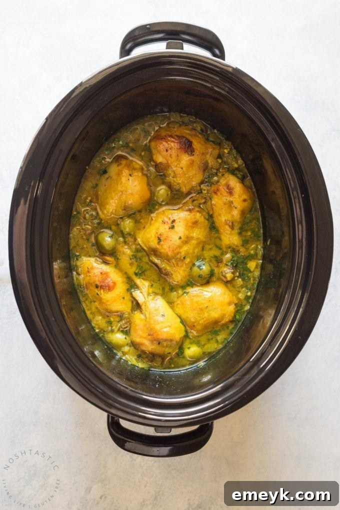 Authentic Slow Cooker Chicken Tagine featuring succulent chicken, olives, preserved lemons, and fragrant Moroccan spices.