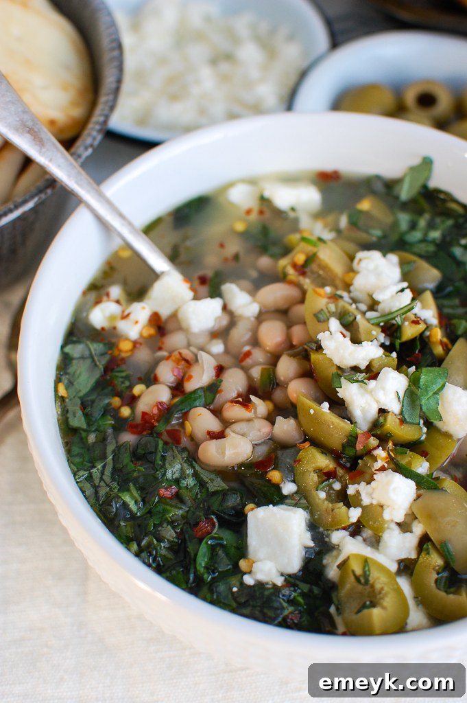 Spoonful of Mediterranean White Bean Soup with a garnish