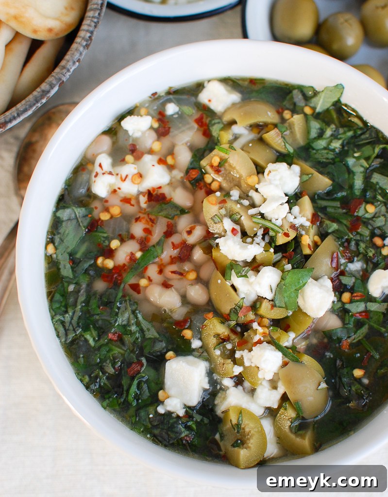 Close-up of Mediterranean White Bean Soup in a white bowl