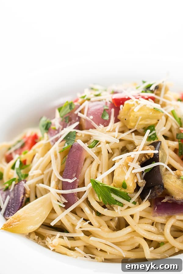 Plant-Powered Plates: 20 Recipes for Peak Energy and Vitality 21 Garlic Roasted Vegetable Pasta, a colorful pasta dish with abundant roasted vegetables.