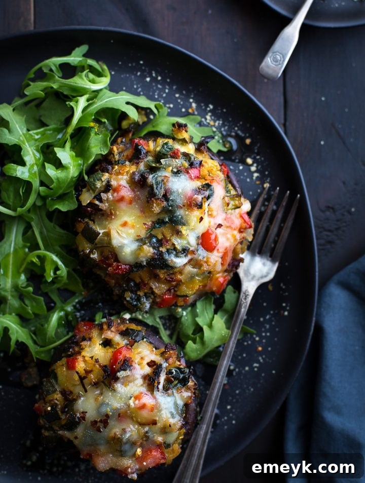 Plant-Powered Plates: 20 Recipes for Peak Energy and Vitality 5 Vegetable Stuffed Portabella Mushrooms, featuring large mushrooms filled with colorful vegetables and herbs.