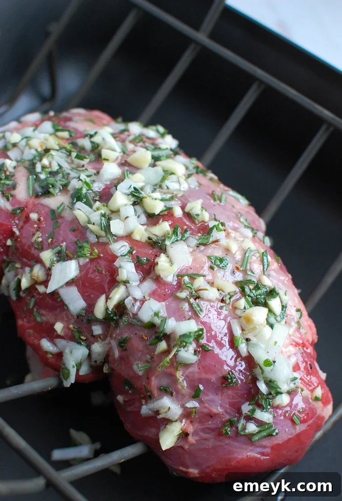 Flawless Roast Beef Every Time 4 Rosemary and Garlic Roast Beef in a roasting pan