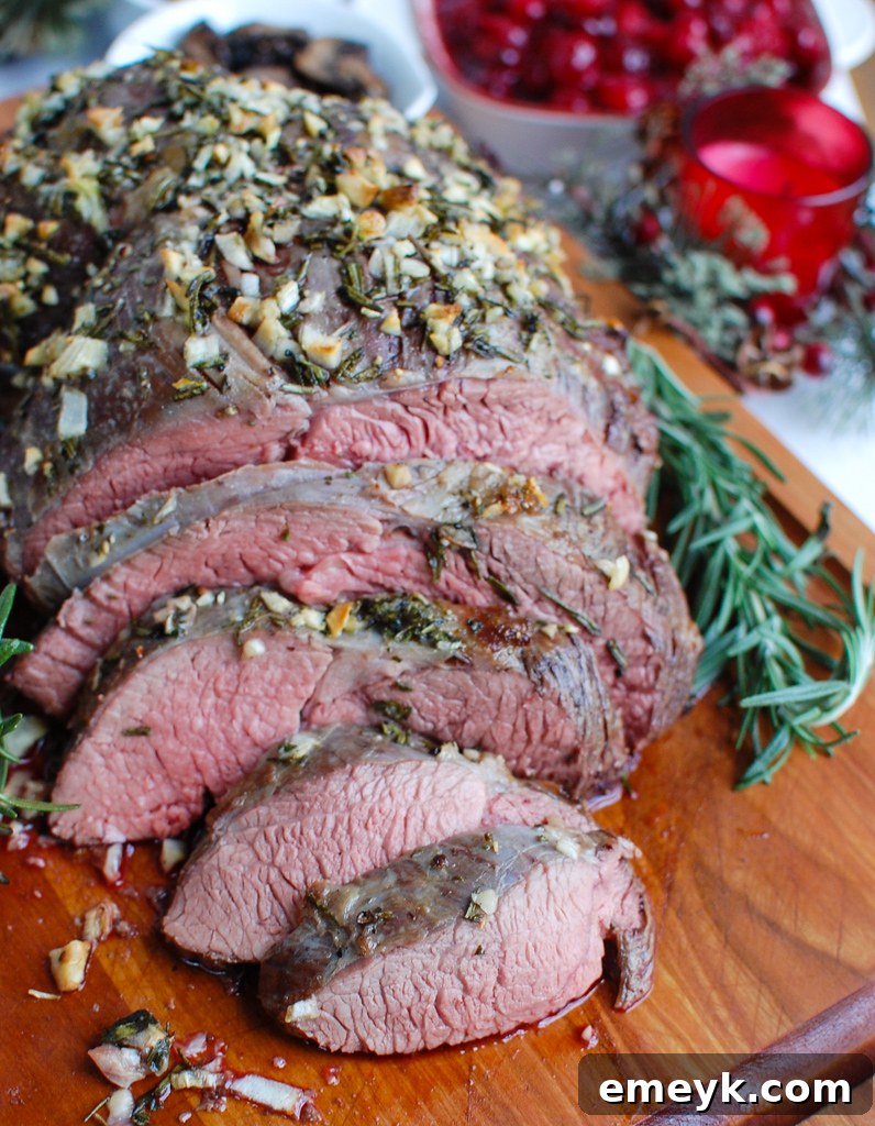 Flawless Roast Beef Every Time 5 The Best Roast Beef Recipe beef on a cutting board, sliced.