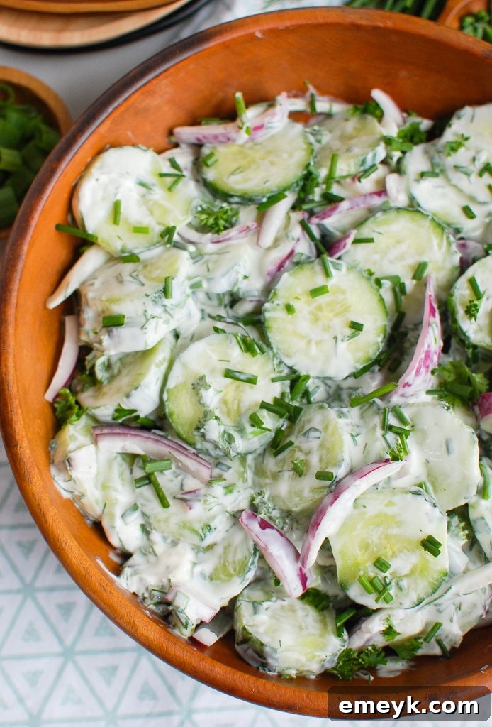 Creamy Cucumber Salad in a Wooden Bowl