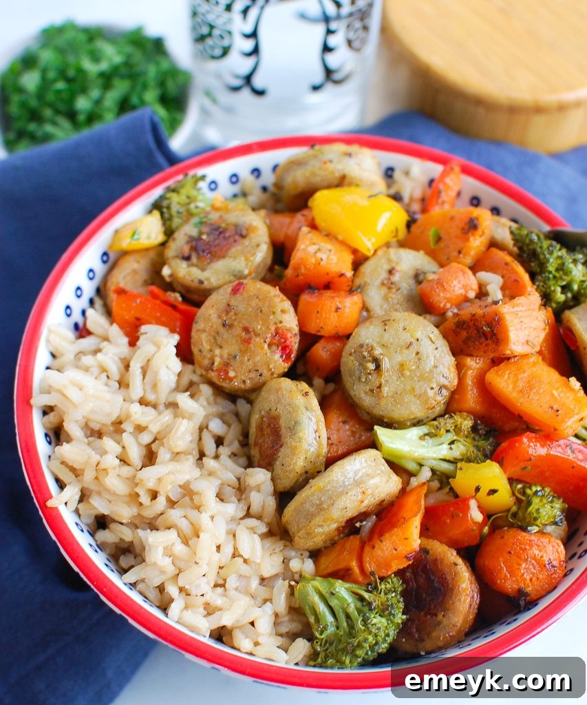 One-Pan Roasted Chicken Sausage and Vegetables 6 A serving of Sheet Pan Chicken Sausage and Vegetables presented in a rustic bowl, garnished with fresh herbs.