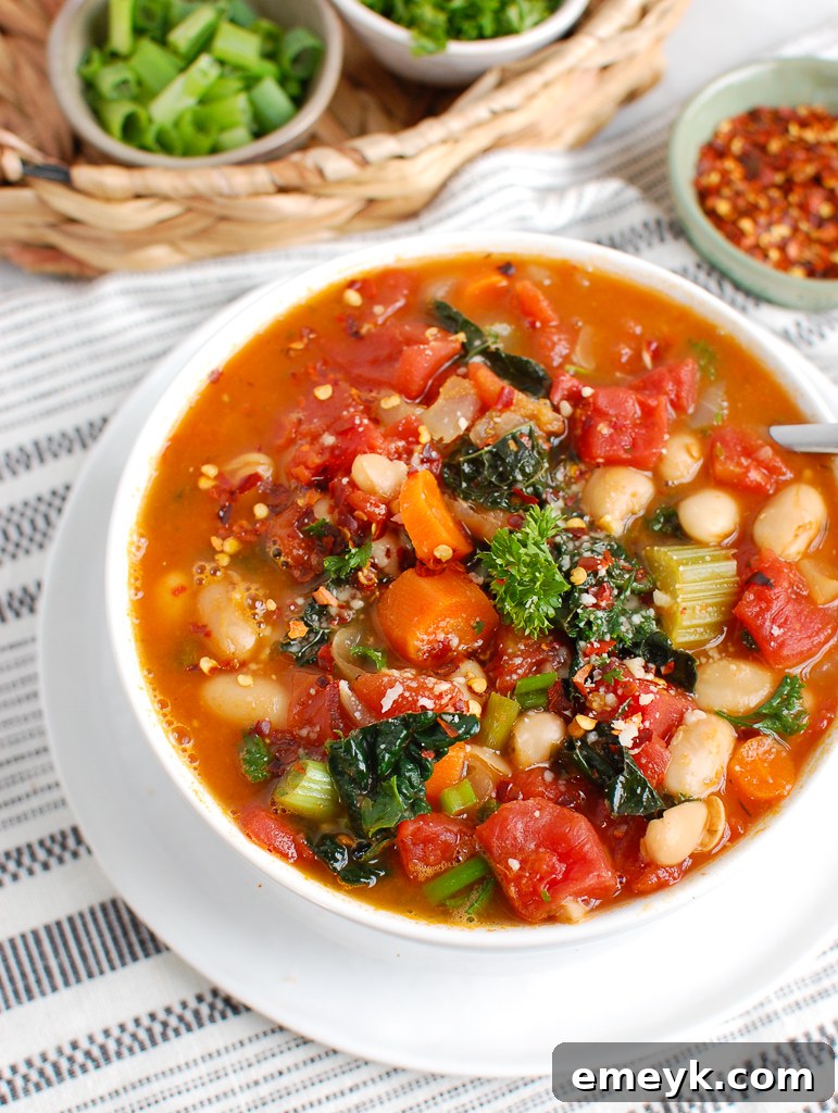 Close-up of White Bean Soup with Kale in a white bowl, showcasing ingredients