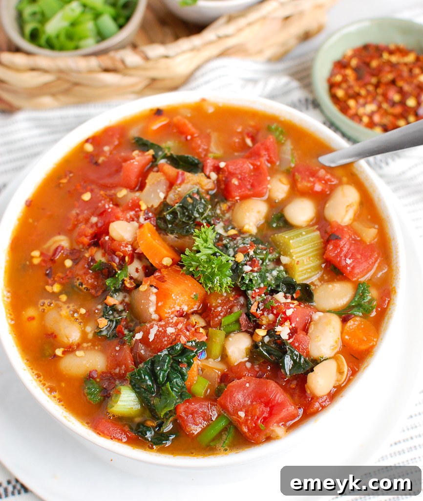 A large pot of White Bean Soup with Kale being served