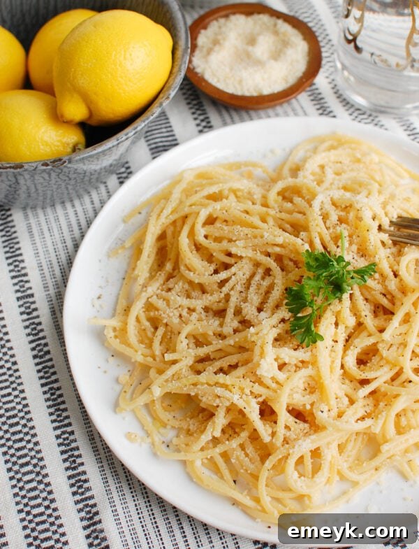 Zesty Lemon Pasta Delight 2 Bright and zesty Lemon Pasta garnished with fresh lemon slices and parsley