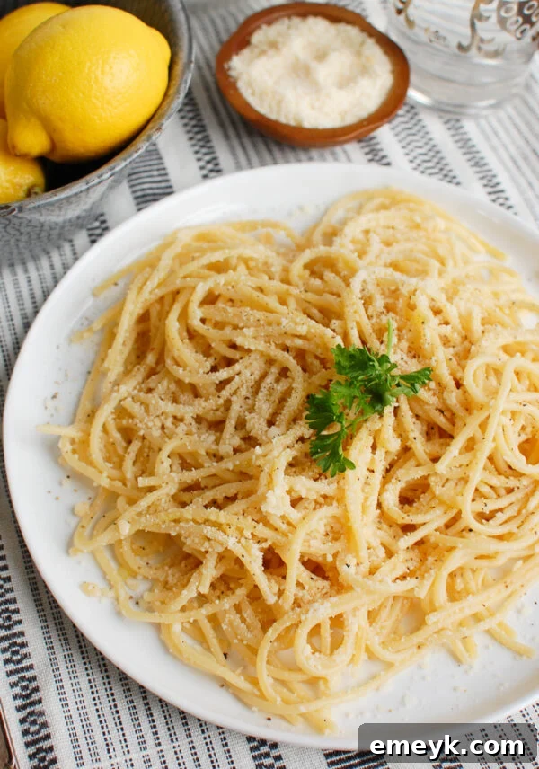 Zesty Lemon Pasta Delight 3 Lemon Pasta adorned with fresh parsley and lemon wedges