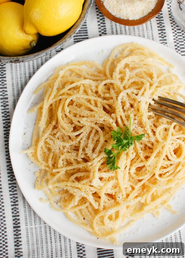 Zesty Lemon Pasta Delight 5 Overhead shot of Lemon Pasta with a fork, ready to be enjoyed