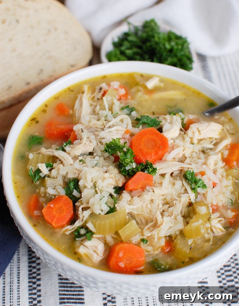 Slow Cooker Chicken and Rice Soup in White Bowl