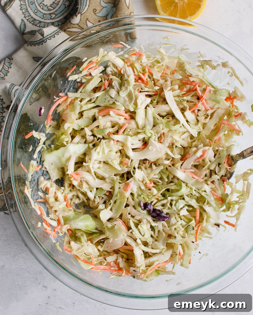 Creamy Coleslaw Recipe in a clear glass bowl, showcasing its texture