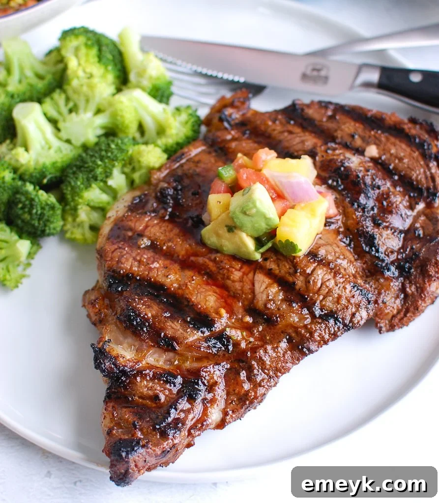 Grilled Ribeye Steak with Avocado Salsa on a plate