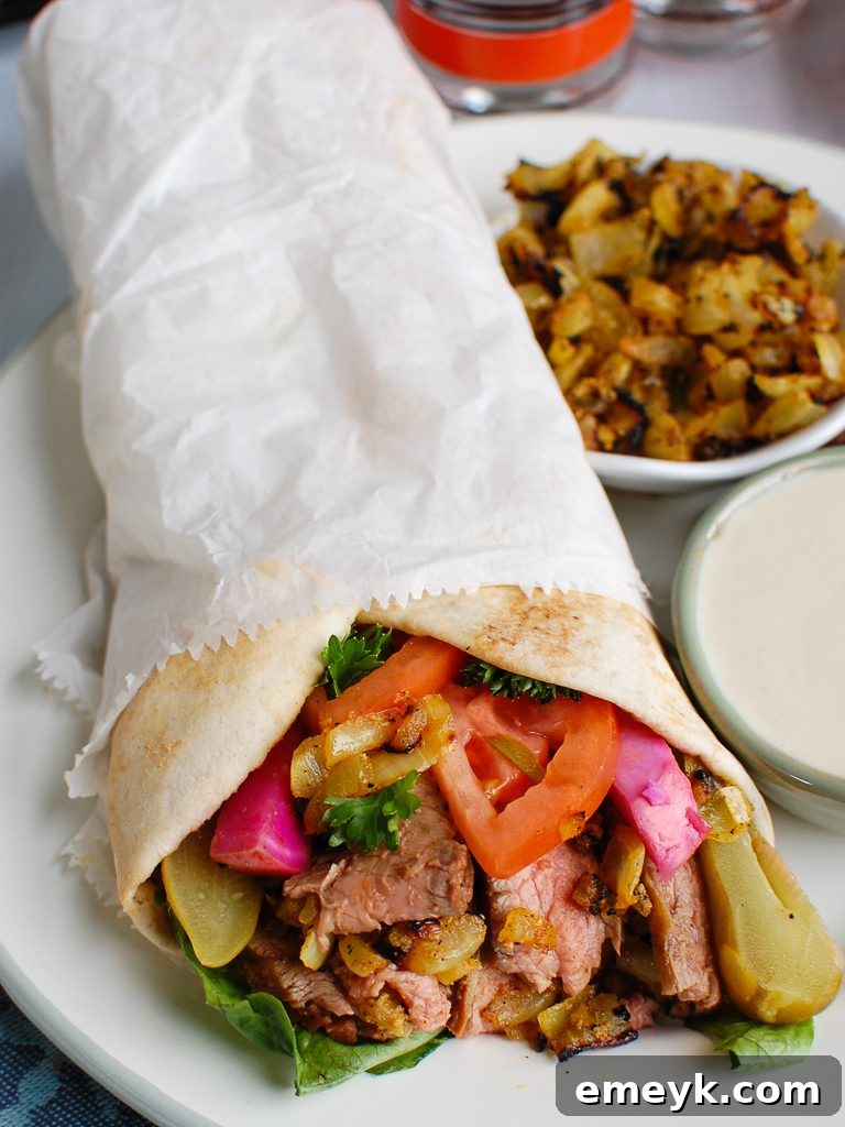 A savory Beef Shawarma, perfectly wrapped in warm pita bread, ready to be enjoyed.
