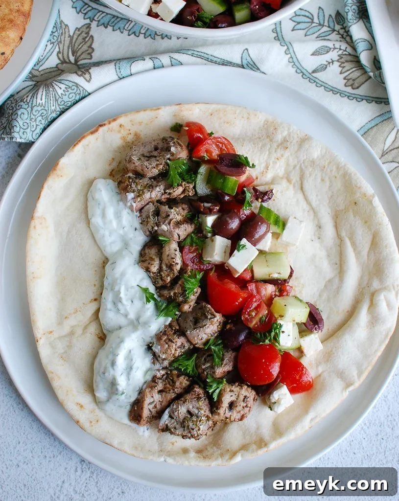 Pork Souvlaki with Tzatziki and a side of fresh Greek Salad