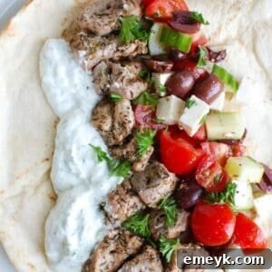 Pork Souvlaki with Tzatziki on skewers with pita bread and salad