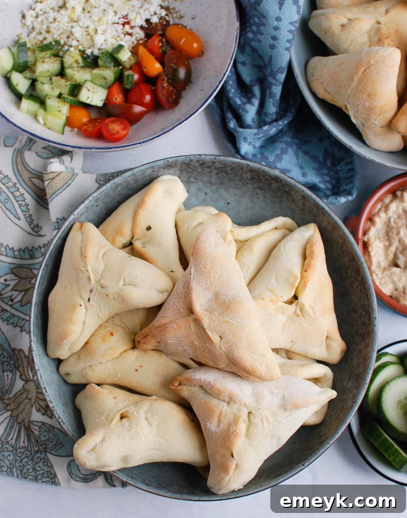 Quick Lebanese Spinach Hand Pies 5 A large bowl brimming with freshly baked, golden Spinach Fatayer.