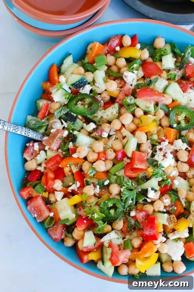 Refreshing Chickpea Salad with crunchy vegetables, feta cheese, and a light lemon dressing
