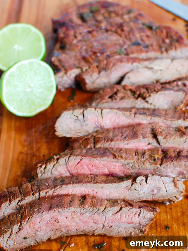 Fire-Kissed Carne Asada 3 Grilled Carne Asada with fork