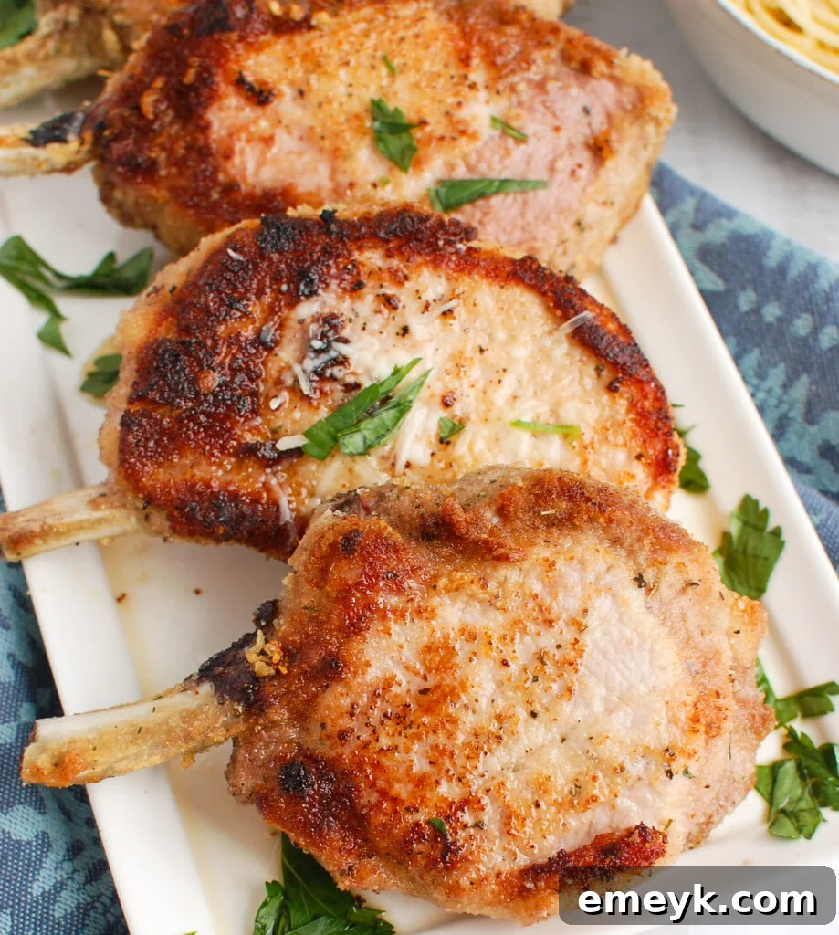 How to Bake Pork Chops in the Oven on white plate