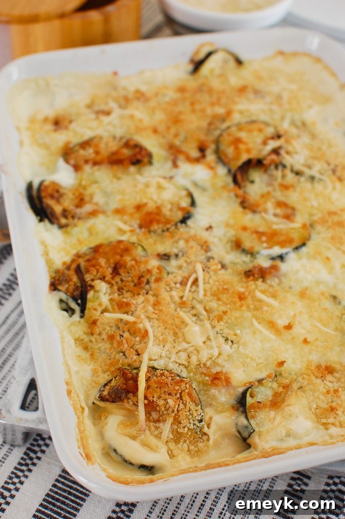 Delicious Zucchini Gratin in a white casserole dish, ready to serve.