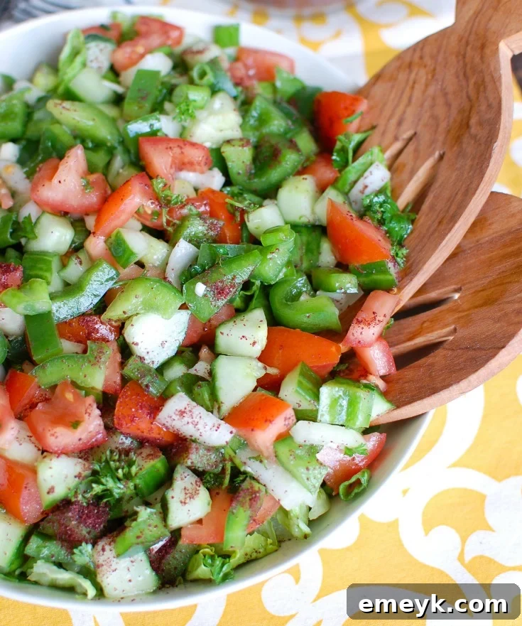 Classic Easy Lebanese Salad (Salata) with finely diced tomatoes, cucumbers, parsley, and a lemon-garlic dressing.
